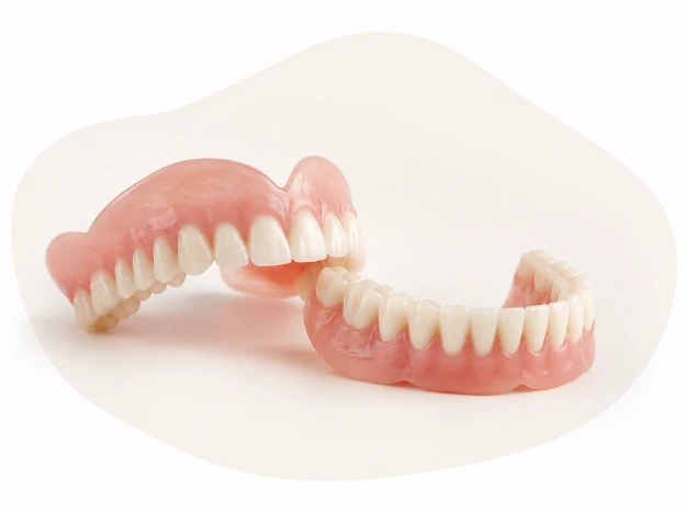 Complete upper and lower dentures displayed on a clean white background